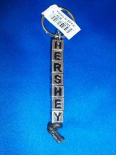 You will receive 12 Hershey Keychains. They are silver cubes with the 