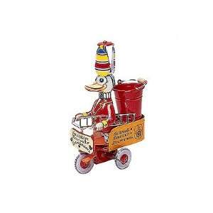  Tin wind up firefighter duck on tricycle figurine