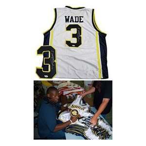 com Dwyane Wade Autographed / Signed Authentic White Marquette Jersey 