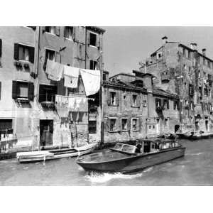  A Man Takes His Boat Through the Canal Premium 