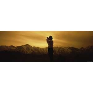 Silhouette of a Man Looking through Binoculars, Californian Sierra 