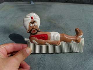   Plastic Comb Genie India Man W Turban on Bed of Nails W Bandaids 6