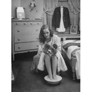Debutante Ann Lincoln Reading While She Soaks Her Feet Stretched 