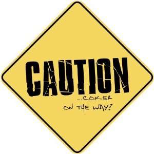   CAUTION  COKER ON THE WAY  CROSSING SIGN