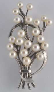 This is a wonderful sterling spray in pin with cultured pearls marked 