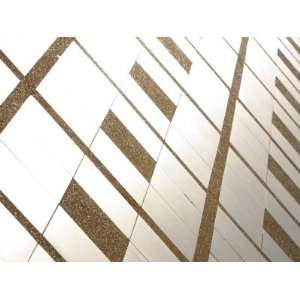 Close up of Shiny Metallic Floor Tiles Laid in Rough Concrete 