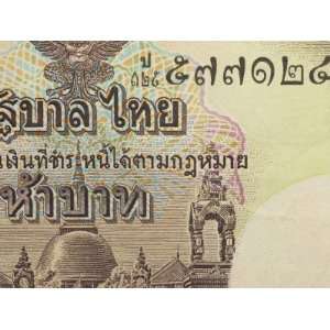  Close Up of Text and Design on Colorful Thai Paper Currency 