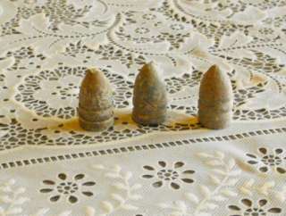 The  auction is for a group of 3 Civil War era lead bullets.