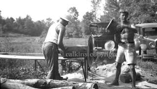 NEGATIVE 2 men with portable saw cutting logs ca 1930  