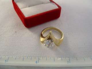  18K GE (18K gold electroplate). V shape setting with faux diamond 