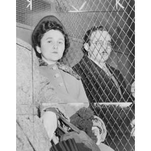  1951 photo Julius and Ethel Rosenberg, separated by heavy 