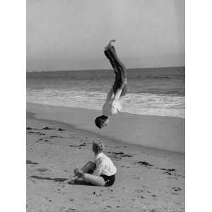  Acrobat/Actor, Russ Tamblyn Doing a Flip on Beach with 