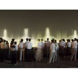  Chinese People Watching a Lighted Musical Water Fountain 