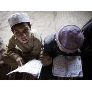  Afghan Refugee Children Read Verses of the Quran During a 